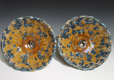 A handmade pair of vessel sinks in nickel crystal glaze with dimples 